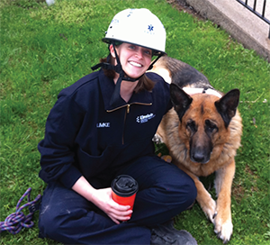 Dr. Klimke taking a break from rope rescue training with Zeus, a retired search-and-rescue canine. 